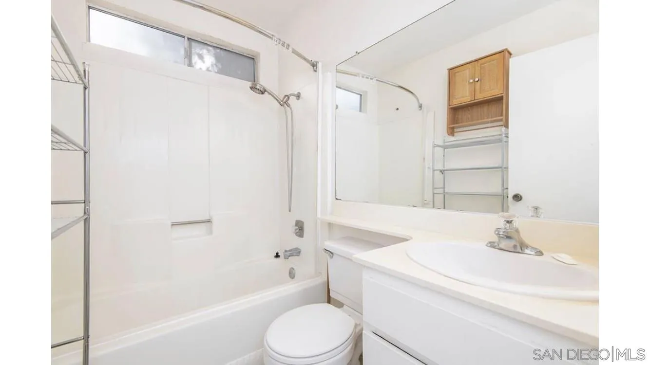 4704 Rim Rock Road Oceanside, CA 92056 - Photo 9 of 11 a bathroom with a sink toilet and shower