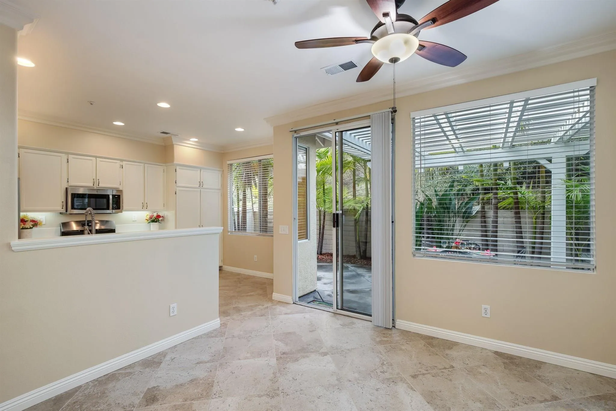 1983 Courage Street Vista, CA 92081 - Photo 14 of 33 a living room with stainless steel appliances kitchen island furniture and a chandelier