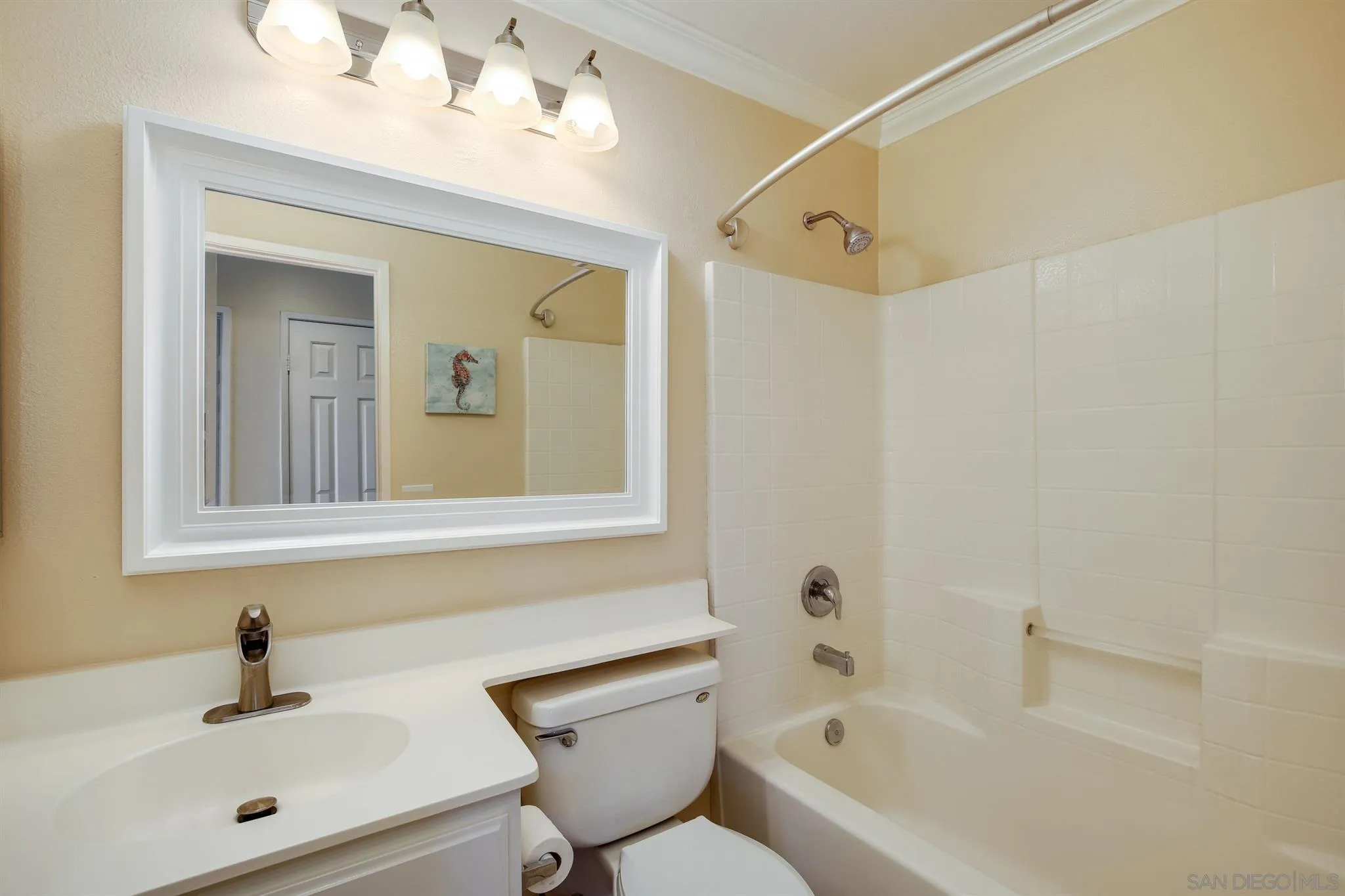 1983 Courage Street Vista, CA 92081 - Photo 22 of 33 a bathroom with a sink mirror and a bathtub