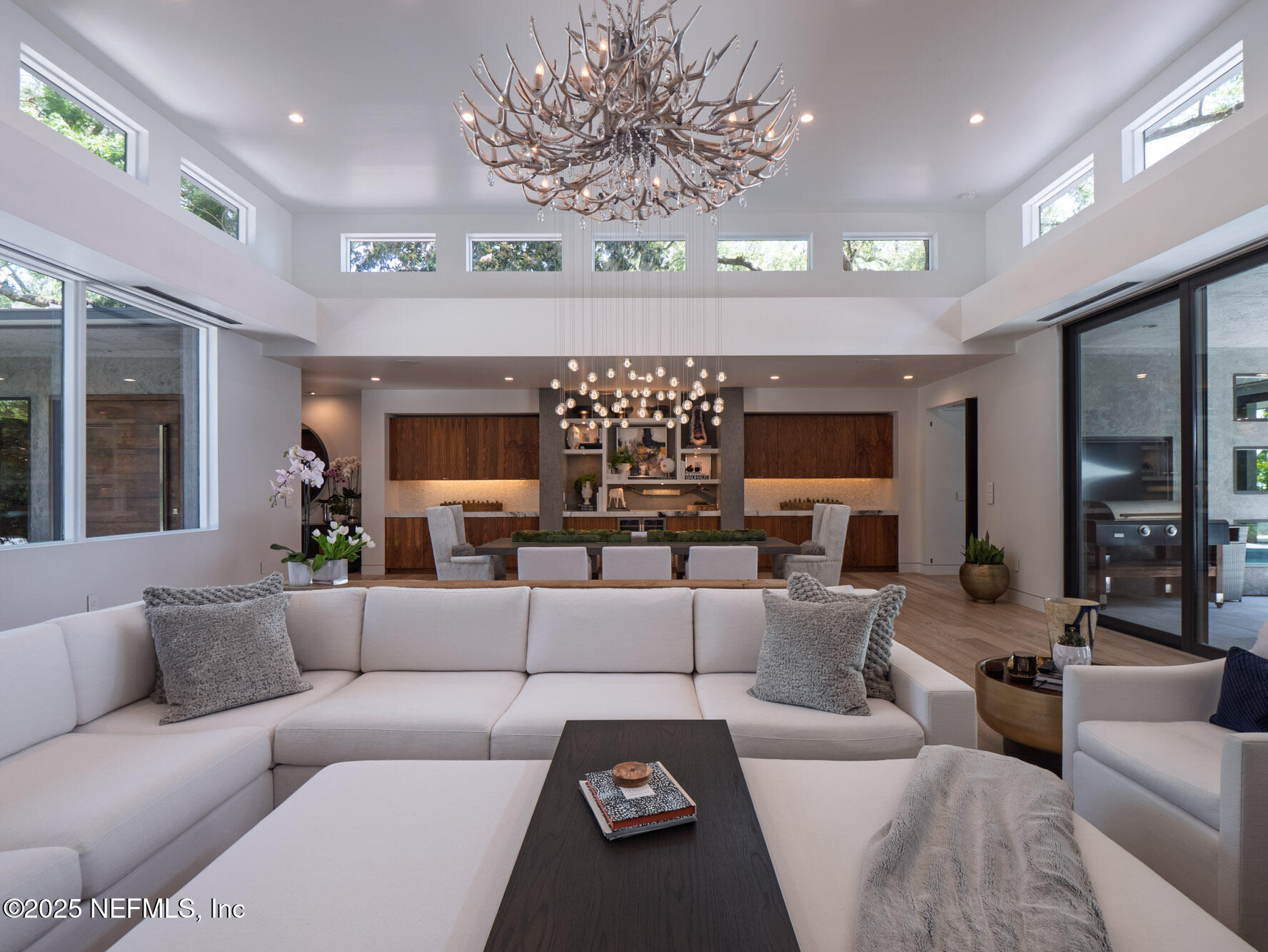 842 Fruit Cove Road St. Johns, FL 32259 - Photo 21 of 100 a living room with furniture and a chandelier