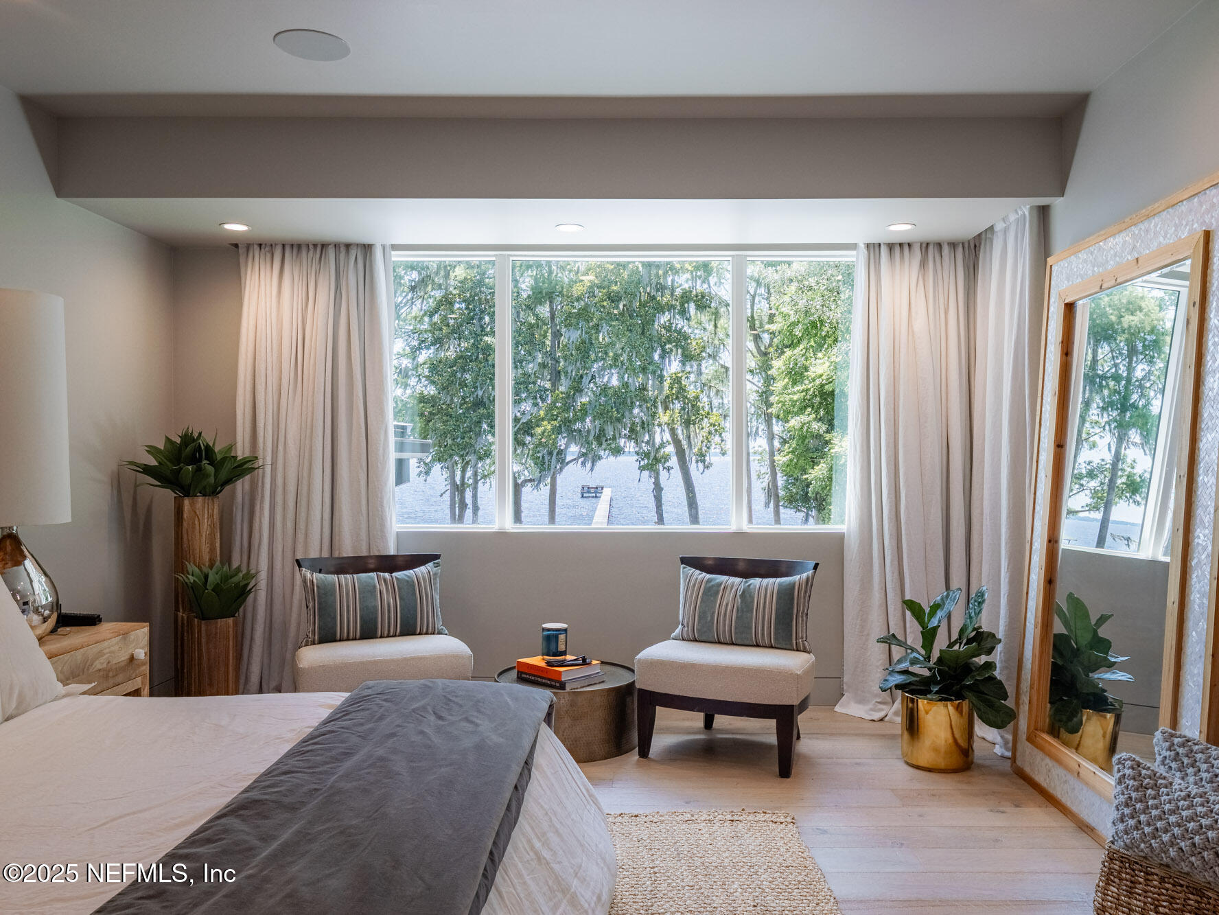 842 Fruit Cove Road St. Johns, FL 32259 - Photo 51 of 100 a bedroom with furniture and a potted plant