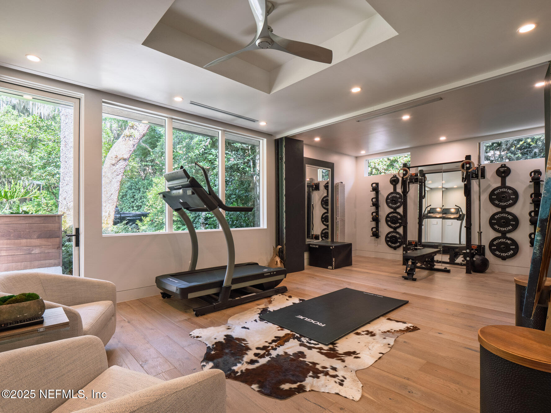 842 Fruit Cove Road St. Johns, FL 32259 - Photo 58 of 100 a living room with furniture hard wood floor and a floor to ceiling window