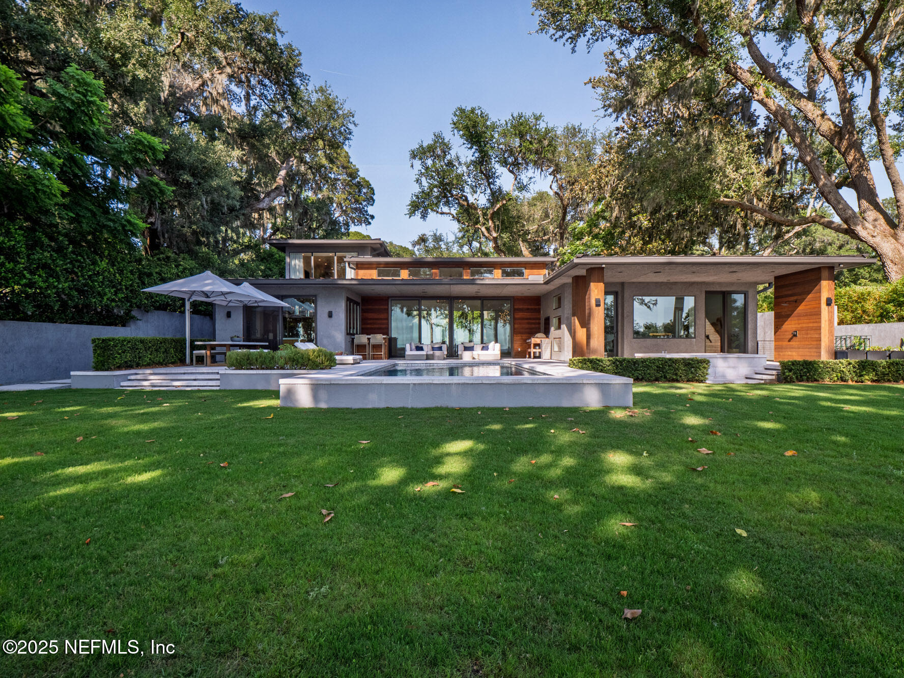 842 Fruit Cove Road St. Johns, FL 32259 - Photo 89 of 100 a front view of a house with a garden and trees