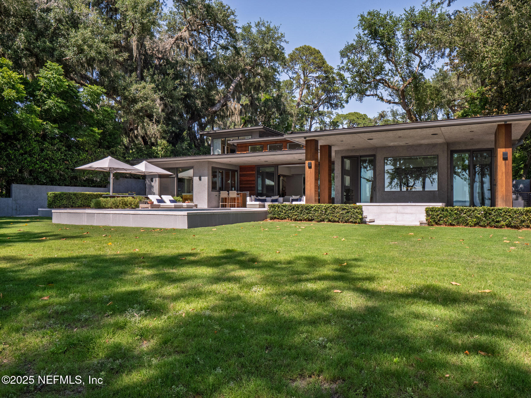 842 Fruit Cove Road St. Johns, FL 32259 - Photo 90 of 100 a view of a house with a yard patio and swimming pool