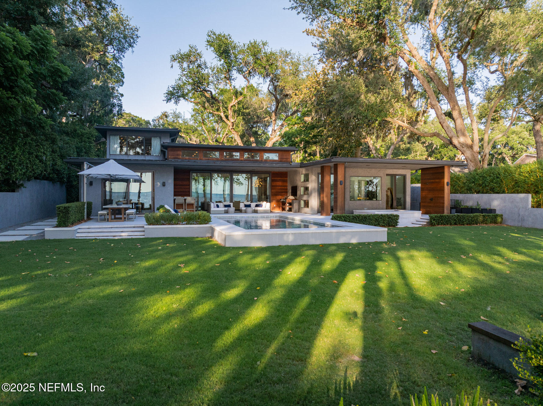 842 Fruit Cove Road St. Johns, FL 32259 - Photo 99 of 100 a swimming pool view with a seating space and a garden view