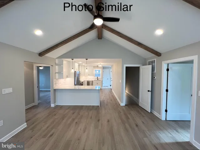 a view of kitchen and wooden floor