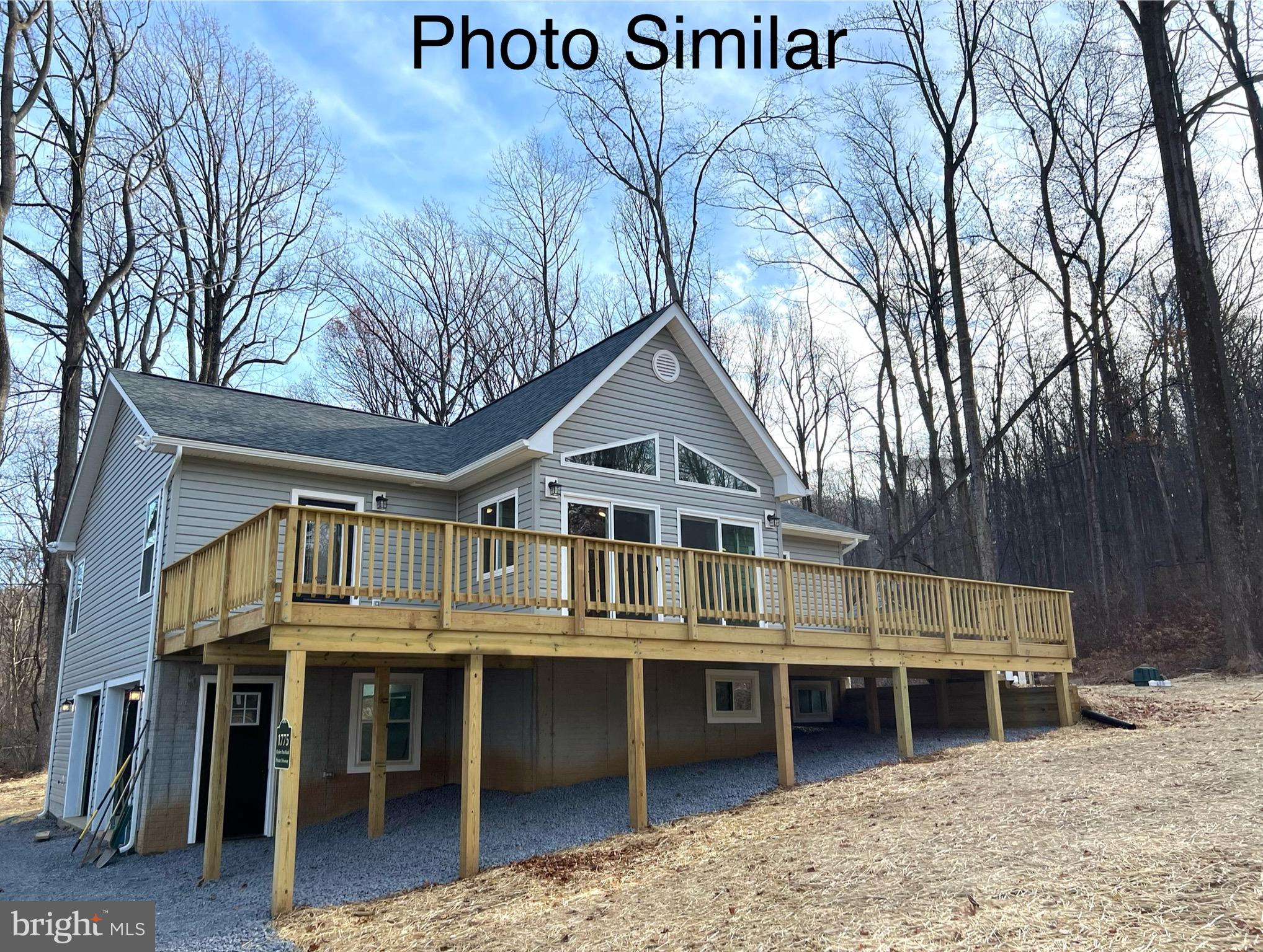 0 Sleepy Hollow Road Linden, VA 22642 - Photo 2 of 48 a view of a house with a large window and wooden fence