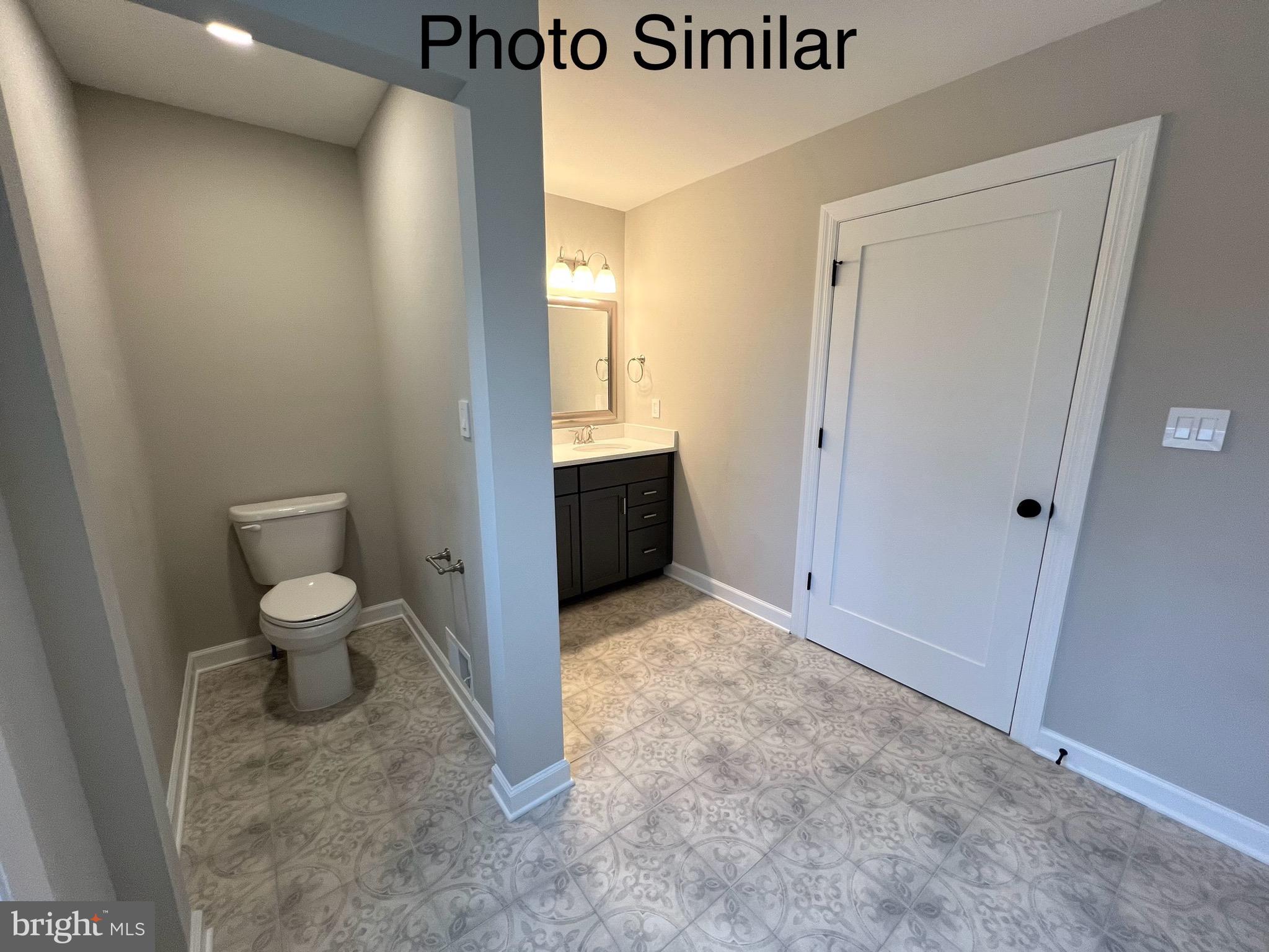 0 Sleepy Hollow Road Linden, VA 22642 - Photo 32 of 48 a bathroom with a granite countertop toilet and a sink
