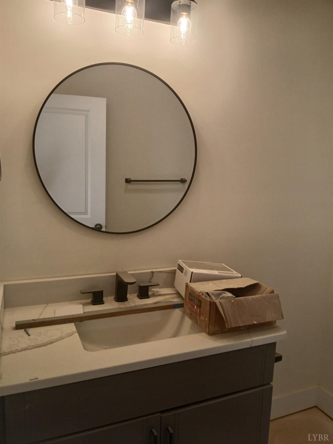 10 Faith Court Rustburg, VA 24588 - Photo 15 of 20 a bathroom with a sink and a mirror