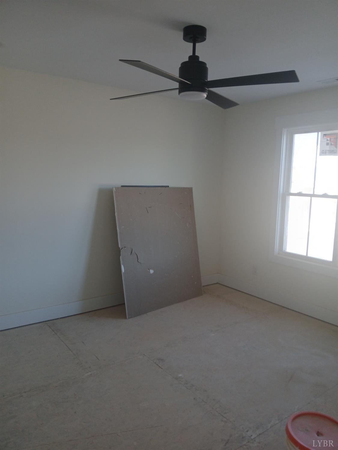 10 Faith Court Rustburg, VA 24588 - Photo 8 of 20 a view of a room with a ceiling fan and a window