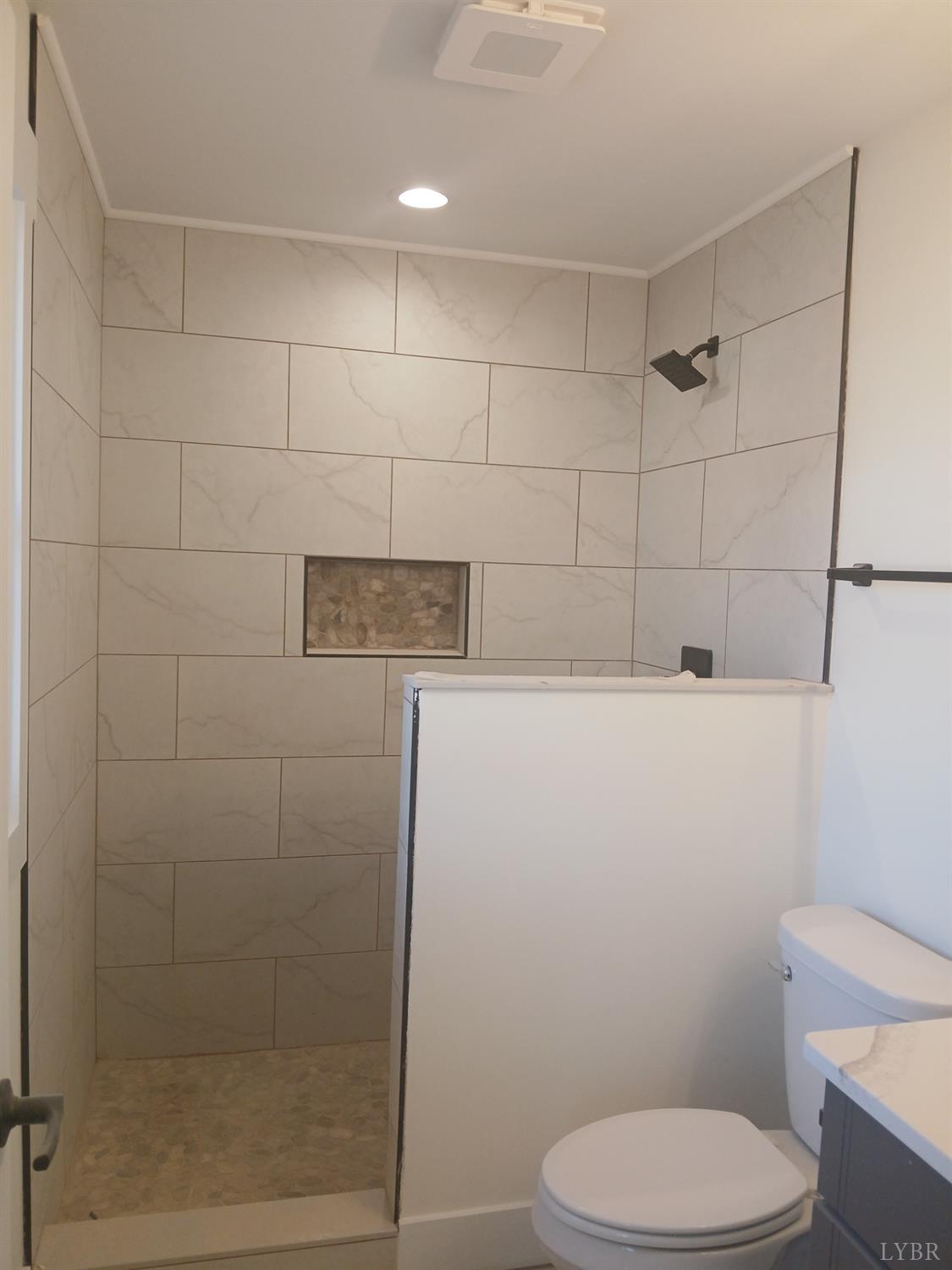 10 Faith Court Rustburg, VA 24588 - Photo 10 of 20 a bathroom with a toilet and a shower