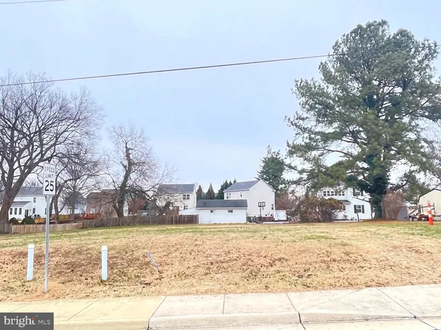 a view of a yard with swimming pool