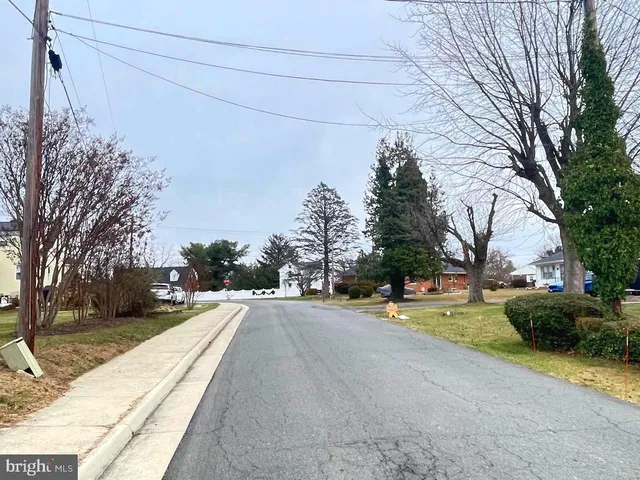 a view of a street with a cars on the road