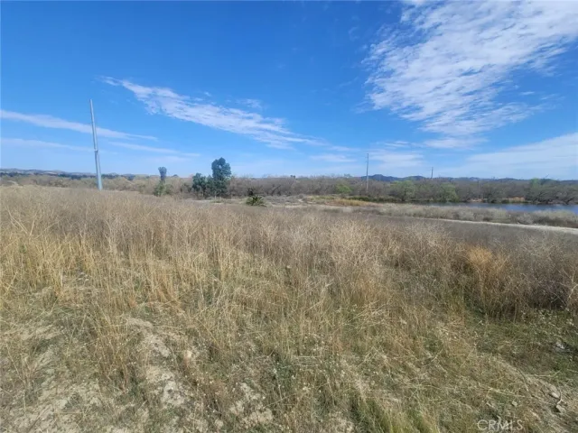 a view of a lake with houses in the back