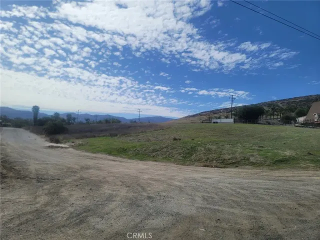 a view of a field with an trees