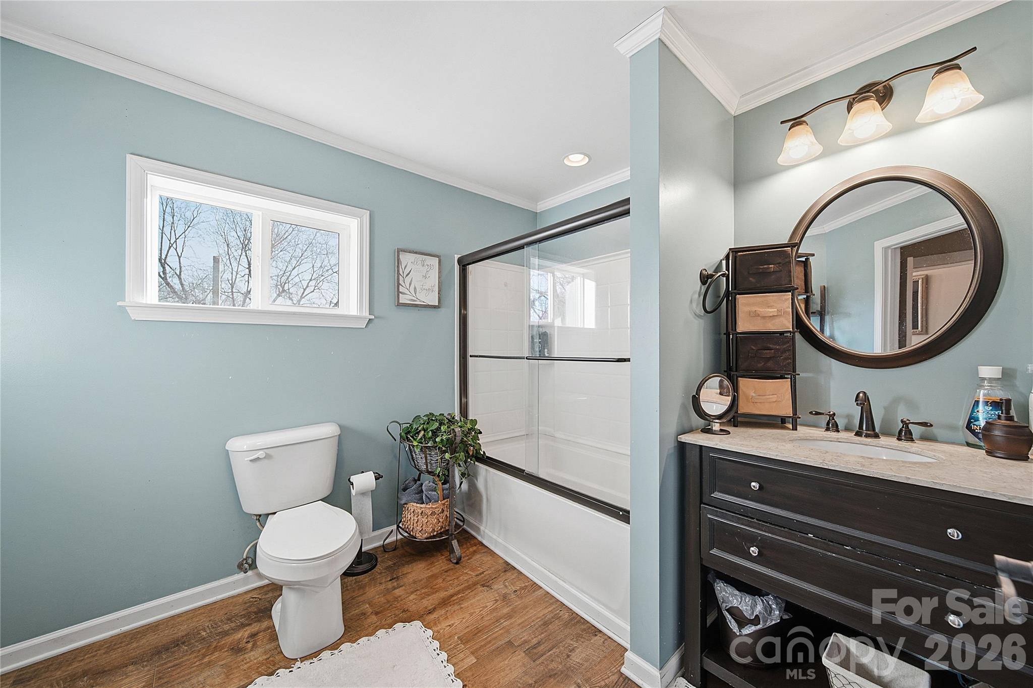 35 Boyden Street Badin, NC 28009 - Photo 11 of 36 a bathroom with a toilet a sink and a mirror