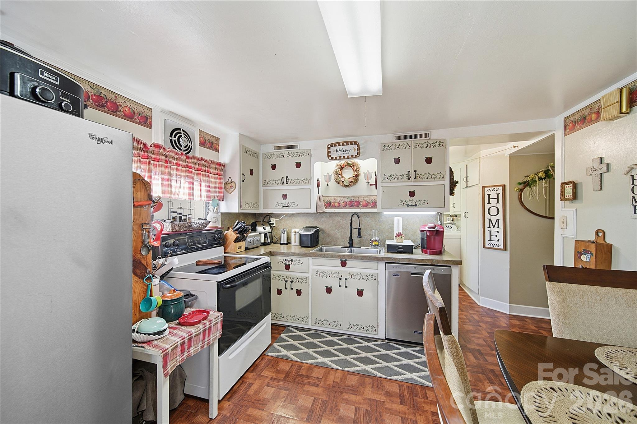 35 Boyden Street Badin, NC 28009 - Photo 20 of 36 a kitchen with a refrigerator and wooden floor