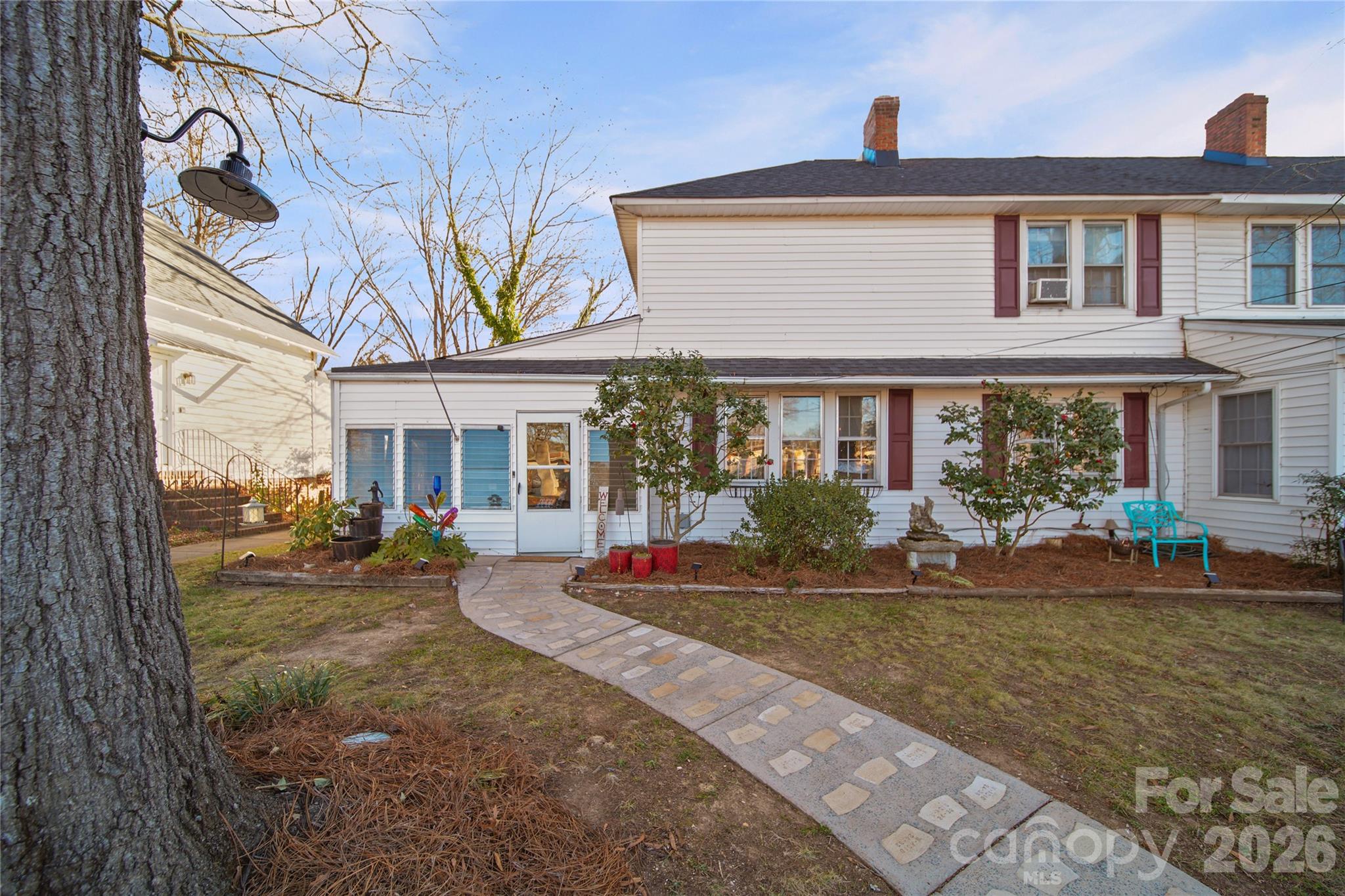 35 Boyden Street Badin, NC 28009 - Photo 2 of 36 a front view of a house with sitting area and chandelier
