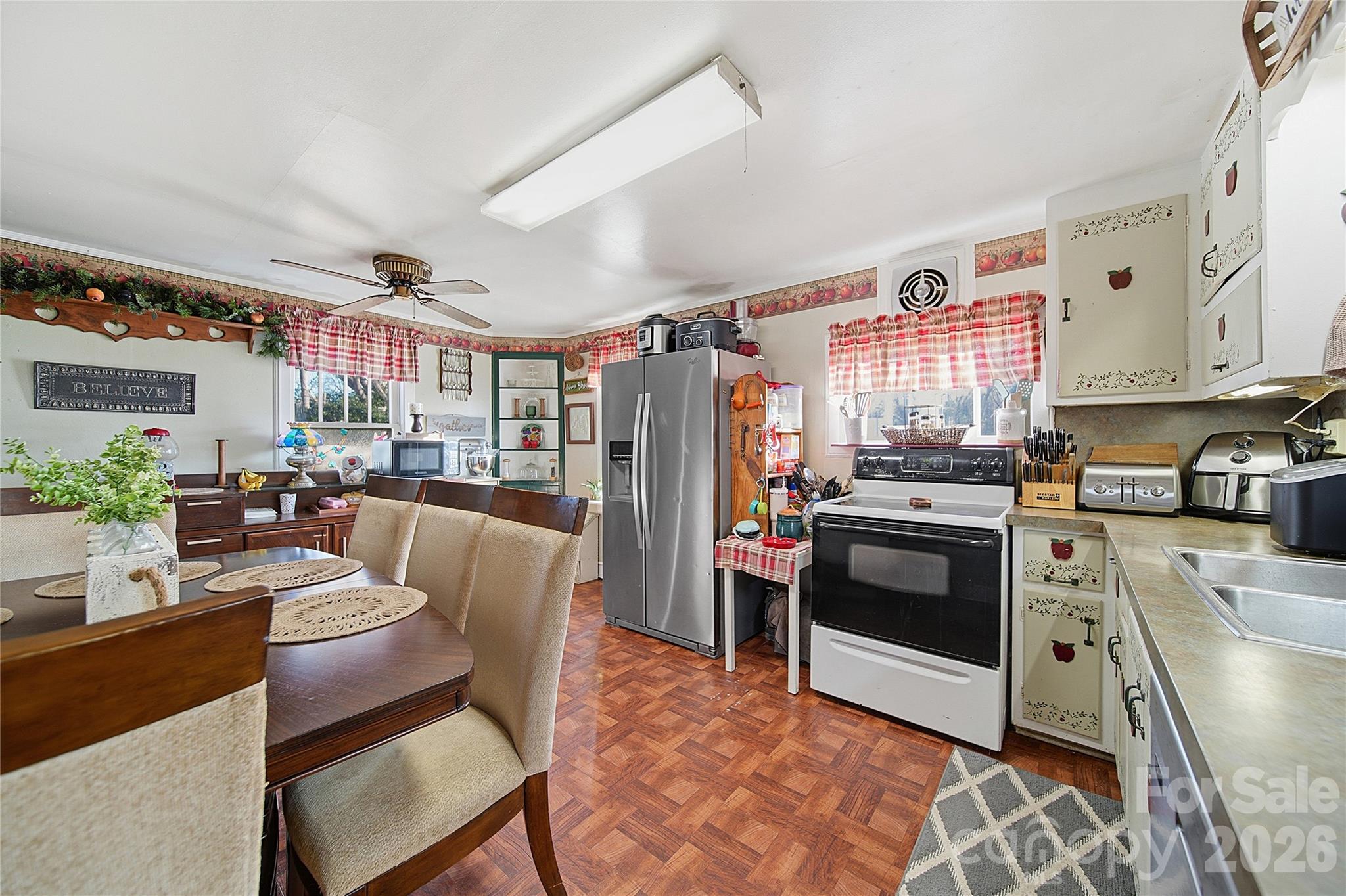 35 Boyden Street Badin, NC 28009 - Photo 21 of 36 a kitchen with stainless steel appliances granite countertop a stove a sink a refrigerator and a refrigerator