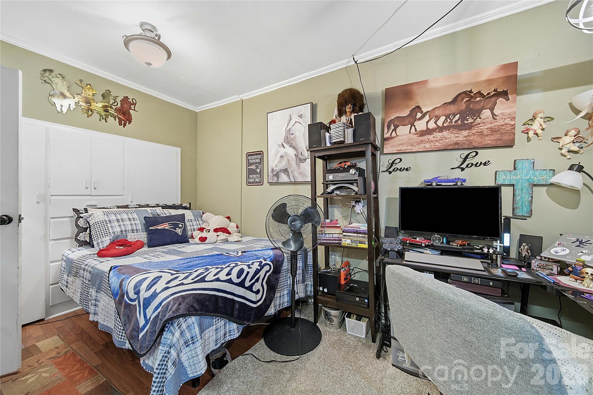 35 Boyden Street Badin, NC 28009 - Photo 23 of 36 a bedroom with a bed and a flat screen tv