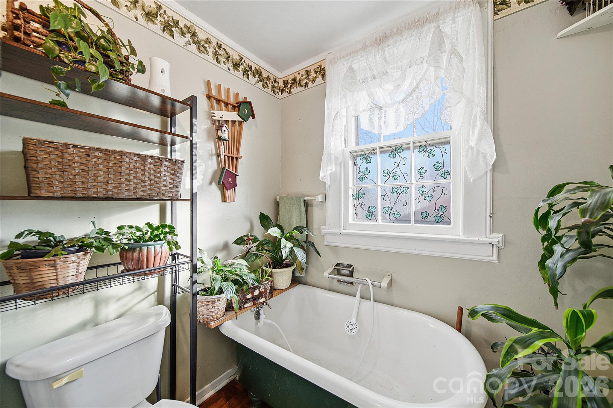 35 Boyden Street Badin, NC 28009 - Photo 26 of 36 a bath room with a sink and a potted plant