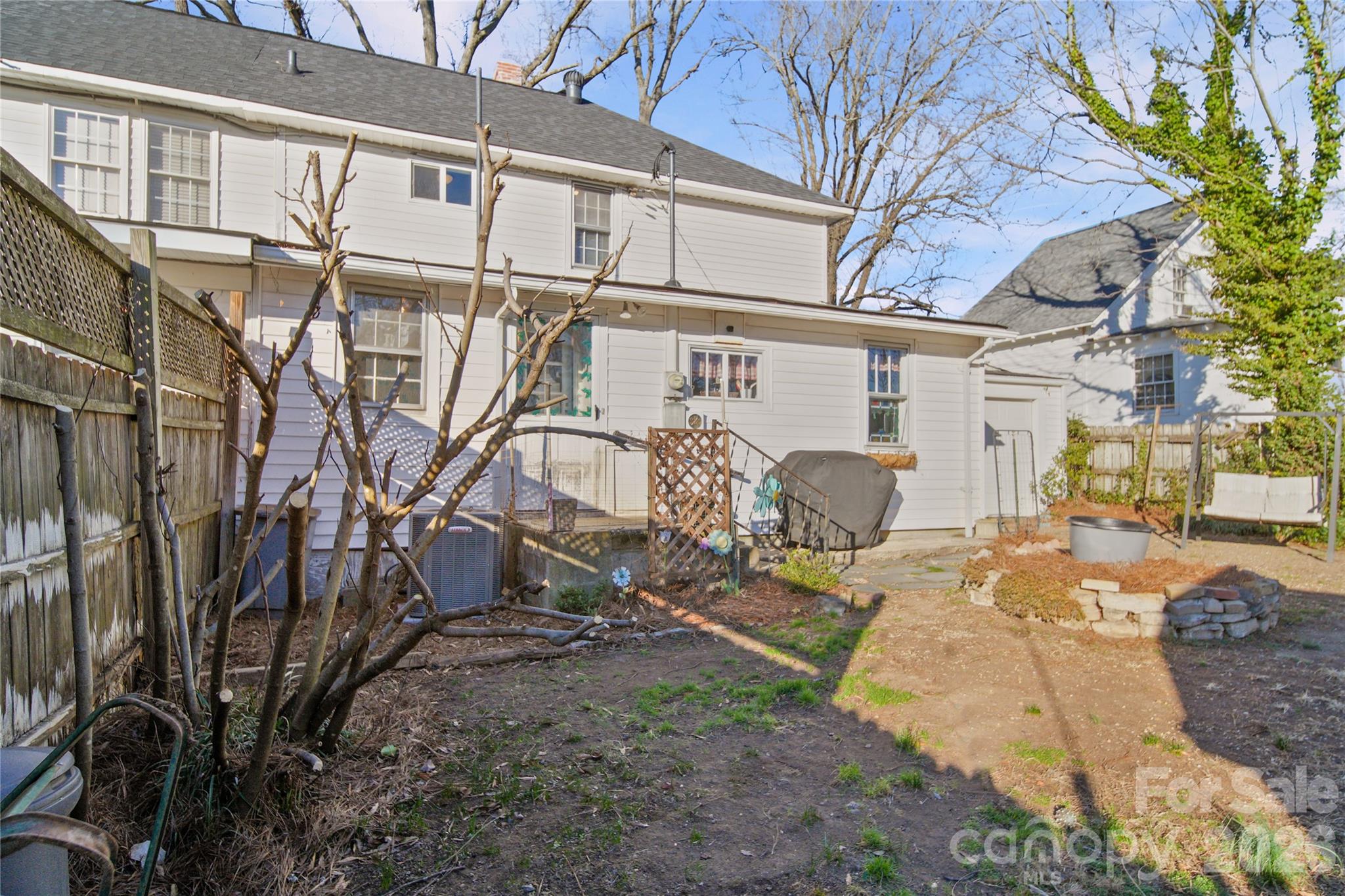 35 Boyden Street Badin, NC 28009 - Photo 31 of 36 a view of a house with backyard and sitting area