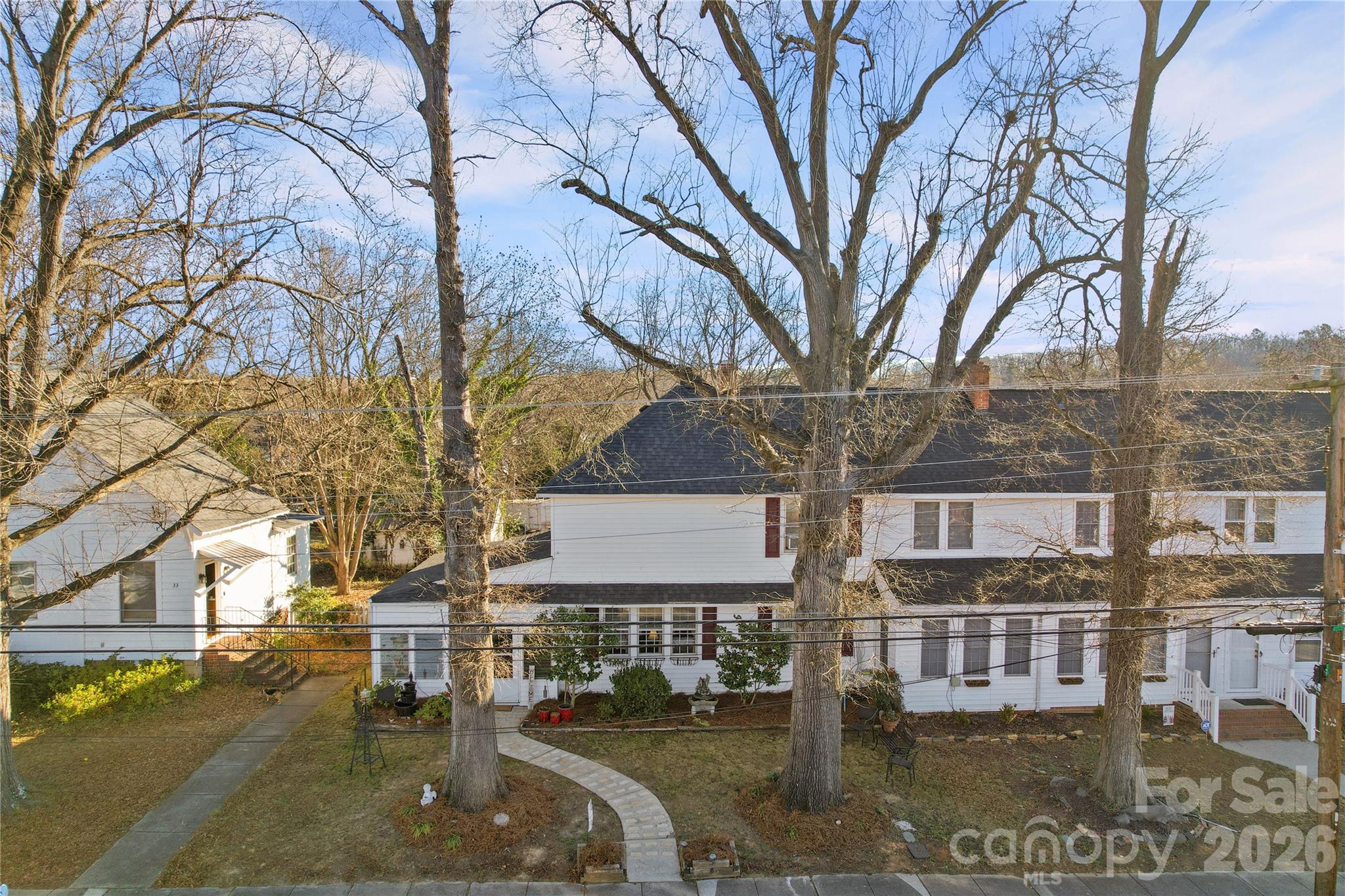 35 Boyden Street Badin, NC 28009 - Photo 4 of 36 a front view of a building with large trees