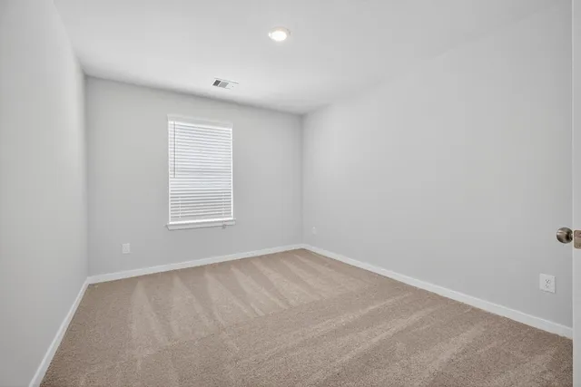 a view of an empty room with a garage