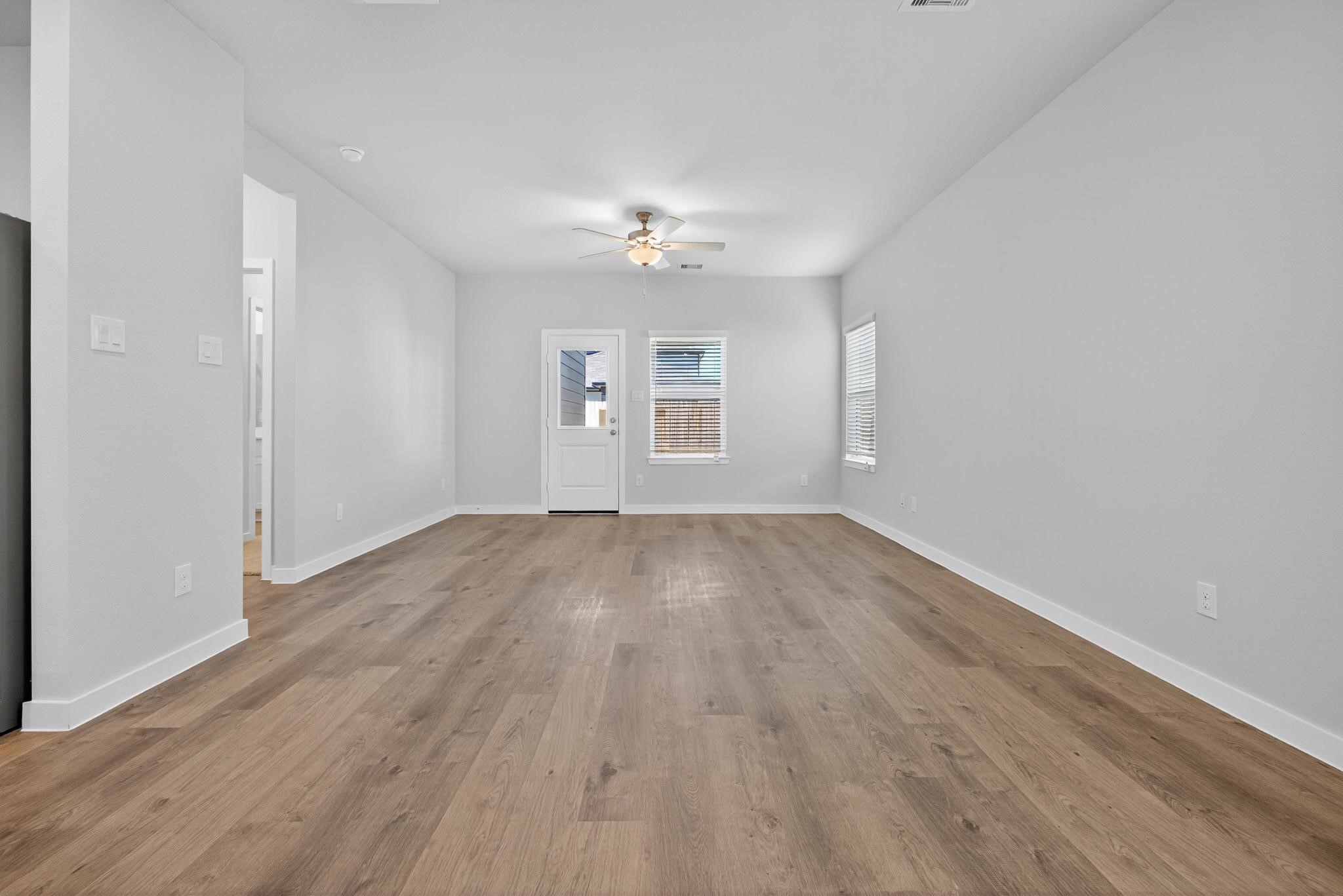 3922 Accolade Crossing Brookshire, TX 77423 - Photo 9 of 27 wooden floor in an empty room with a window