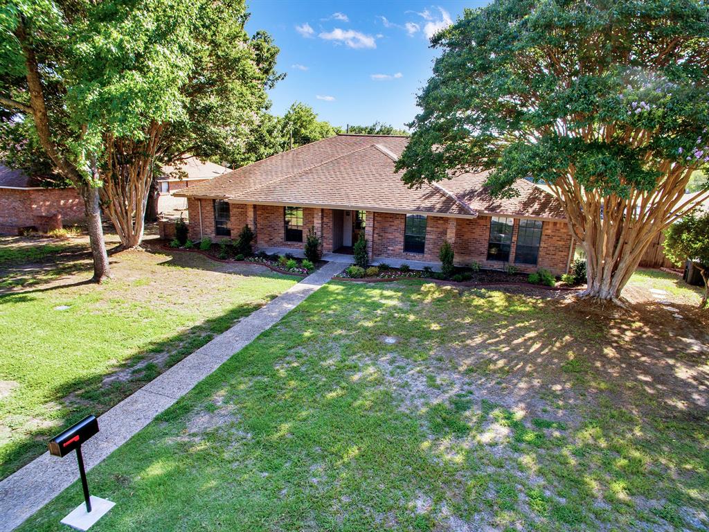 a view of a house with a yard porch and sitting area