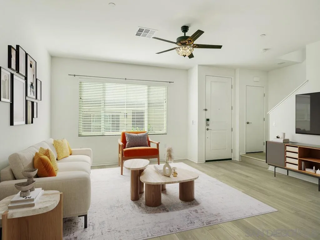 a living room with furniture and a large window