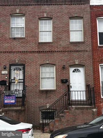 a view of a brick building with many windows