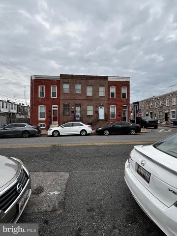 a front view of a house with a street