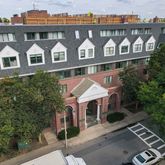 a front view of a building with garden