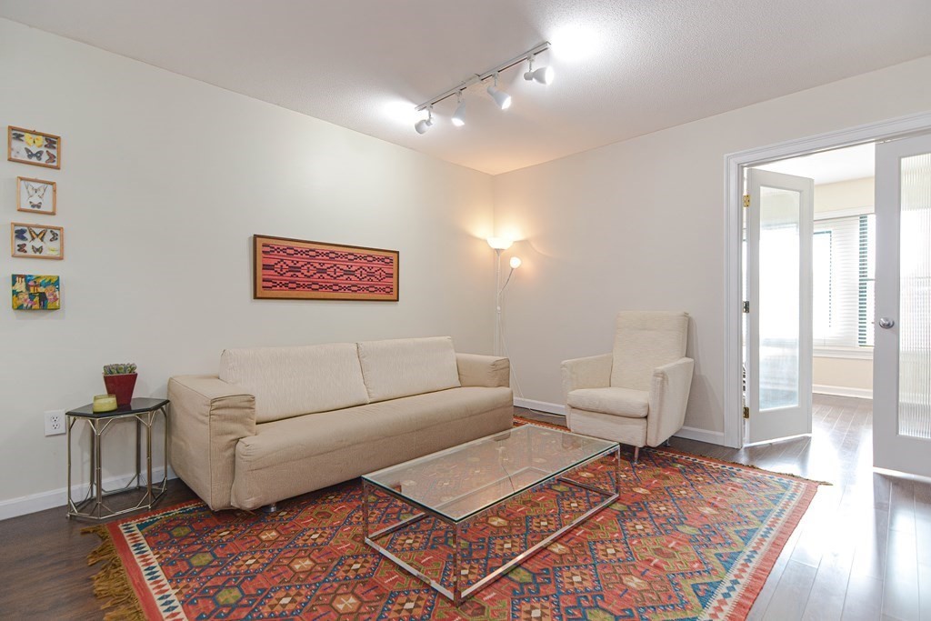 59 Brainerd Road, Unit 410 Boston, MA 02134 - Photo 13 of 41 a living room with furniture and wooden floor