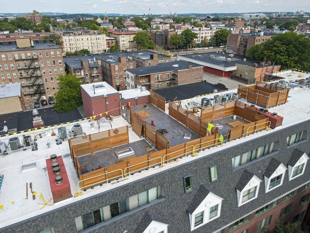59 Brainerd Road, Unit 410 Boston, MA 02134 - Photo 37 of 41 an aerial view of residential houses with outdoor space