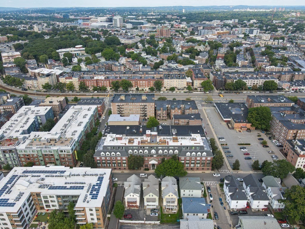 59 Brainerd Road, Unit 410 Boston, MA 02134 - Photo 38 of 41 an aerial view of a city with lots of residential buildings