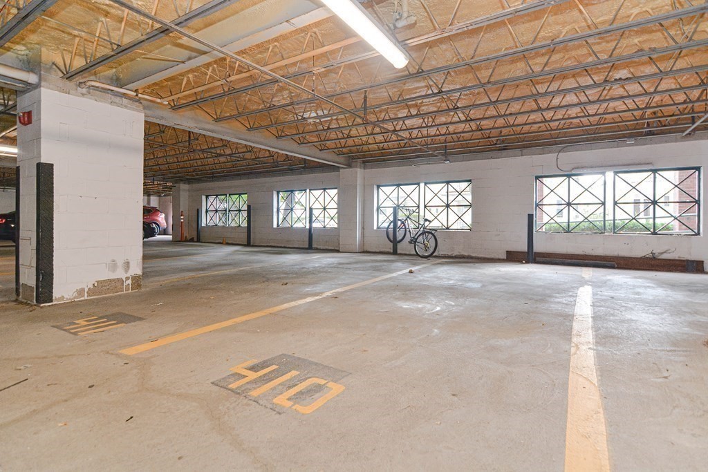 59 Brainerd Road, Unit 410 Boston, MA 02134 - Photo 40 of 41 a view of livingroom with a lot of windows