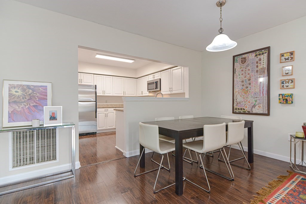59 Brainerd Road, Unit 410 Boston, MA 02134 - Photo 7 of 41 a view of a dining room with furniture and wooden floor
