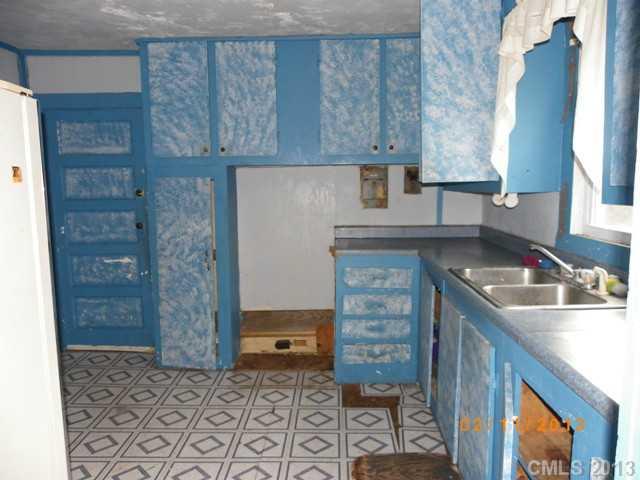 1831 Dunlap Roddey Road Rock Hill, SC 29730 - Photo 4 of 10 a kitchen with a sink a stove and cabinets