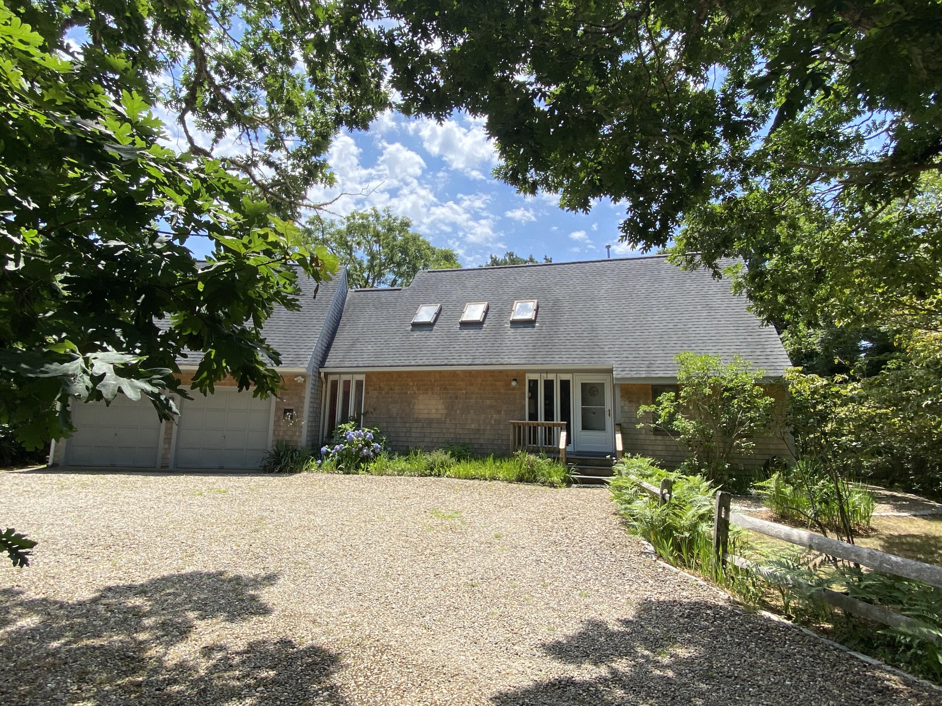 54 Marthas Road Edgartown, MA 02539 - Photo 1 of 30 a front view of house with yard