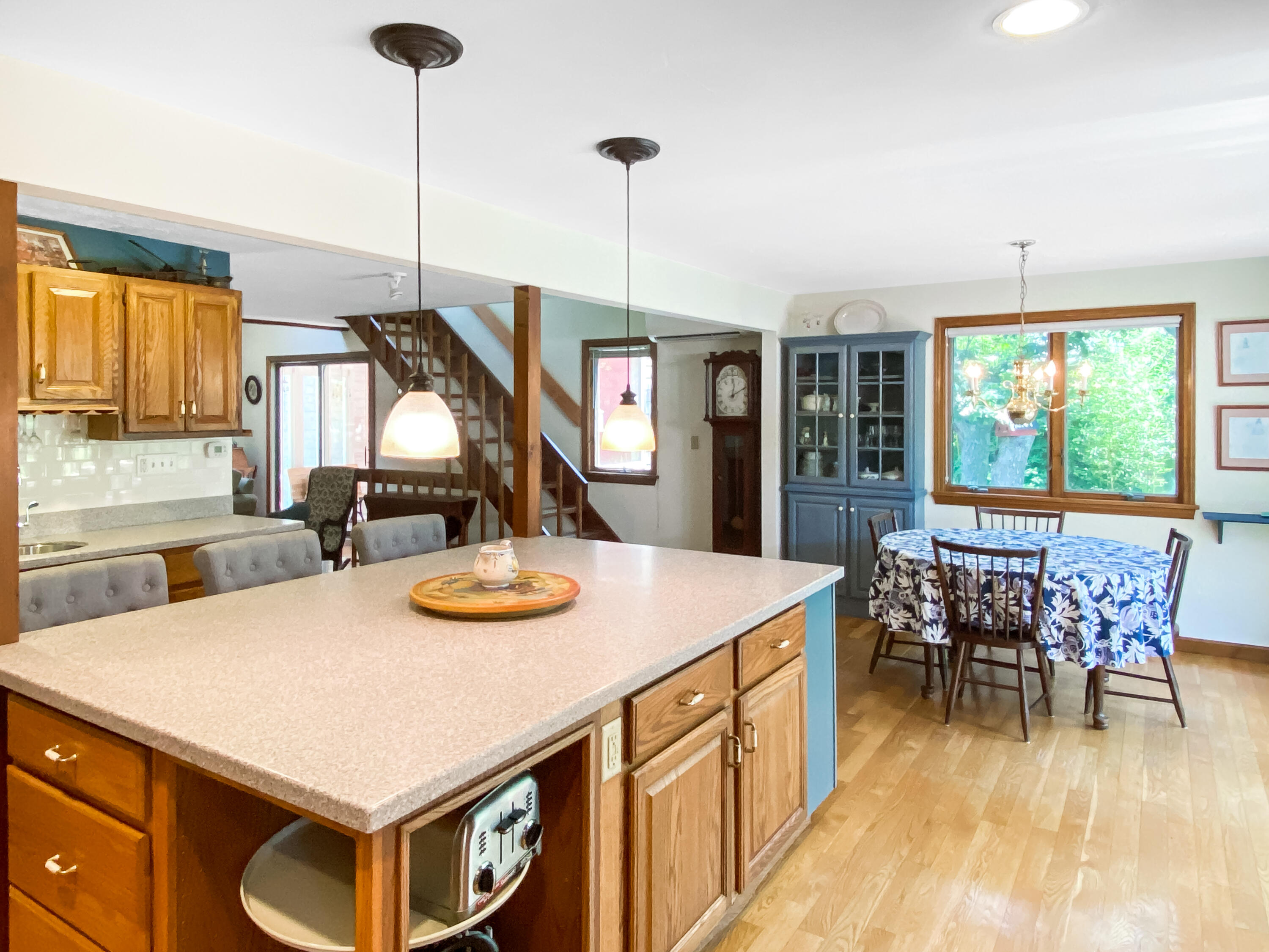 54 Marthas Road Edgartown, MA 02539 - Photo 12 of 30 a kitchen with stainless steel appliances granite countertop sink stove and table