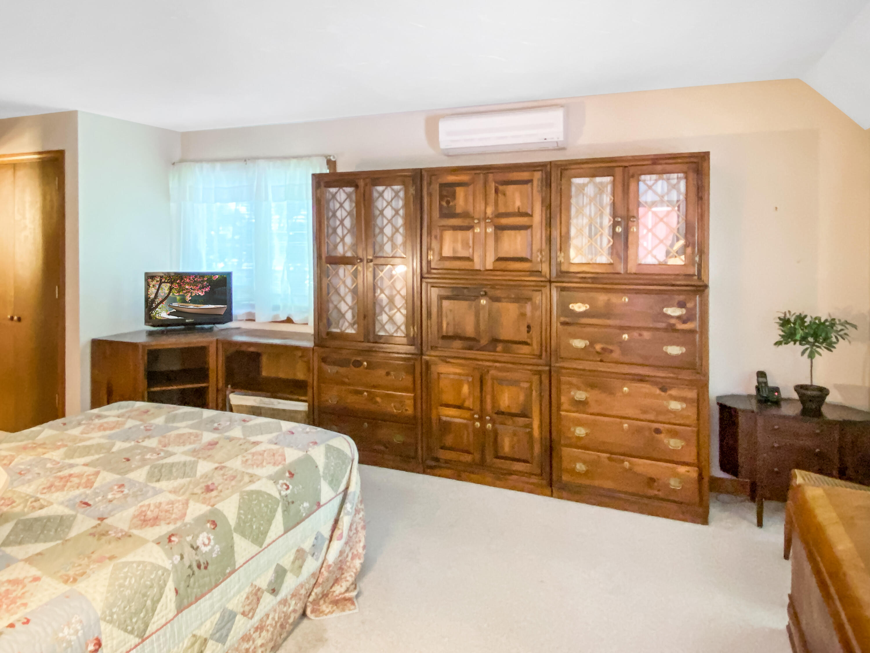 54 Marthas Road Edgartown, MA 02539 - Photo 15 of 30 a bed room with a bed and a dresser