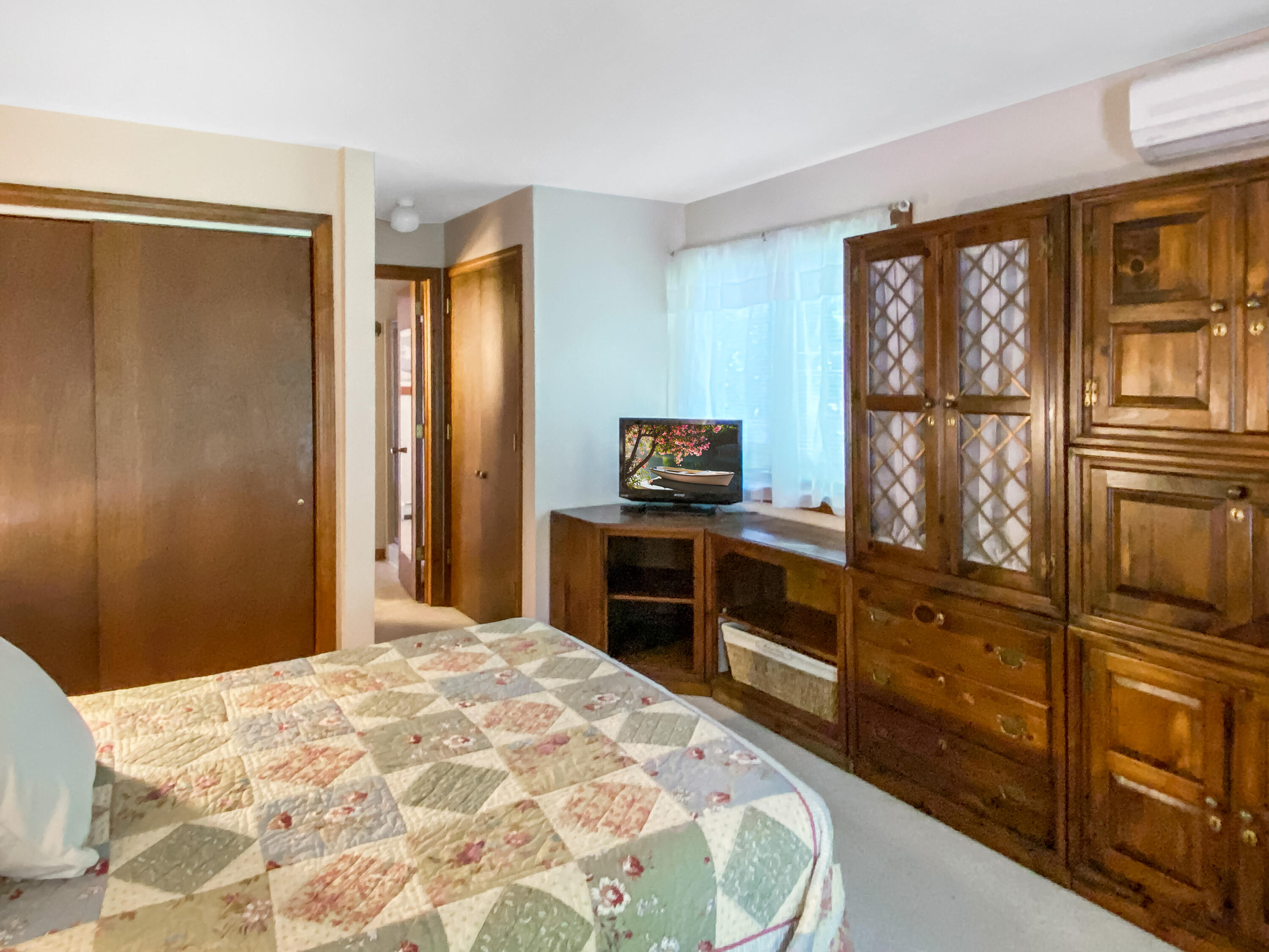 54 Marthas Road Edgartown, MA 02539 - Photo 16 of 30 a bedroom with a bed and a dresser
