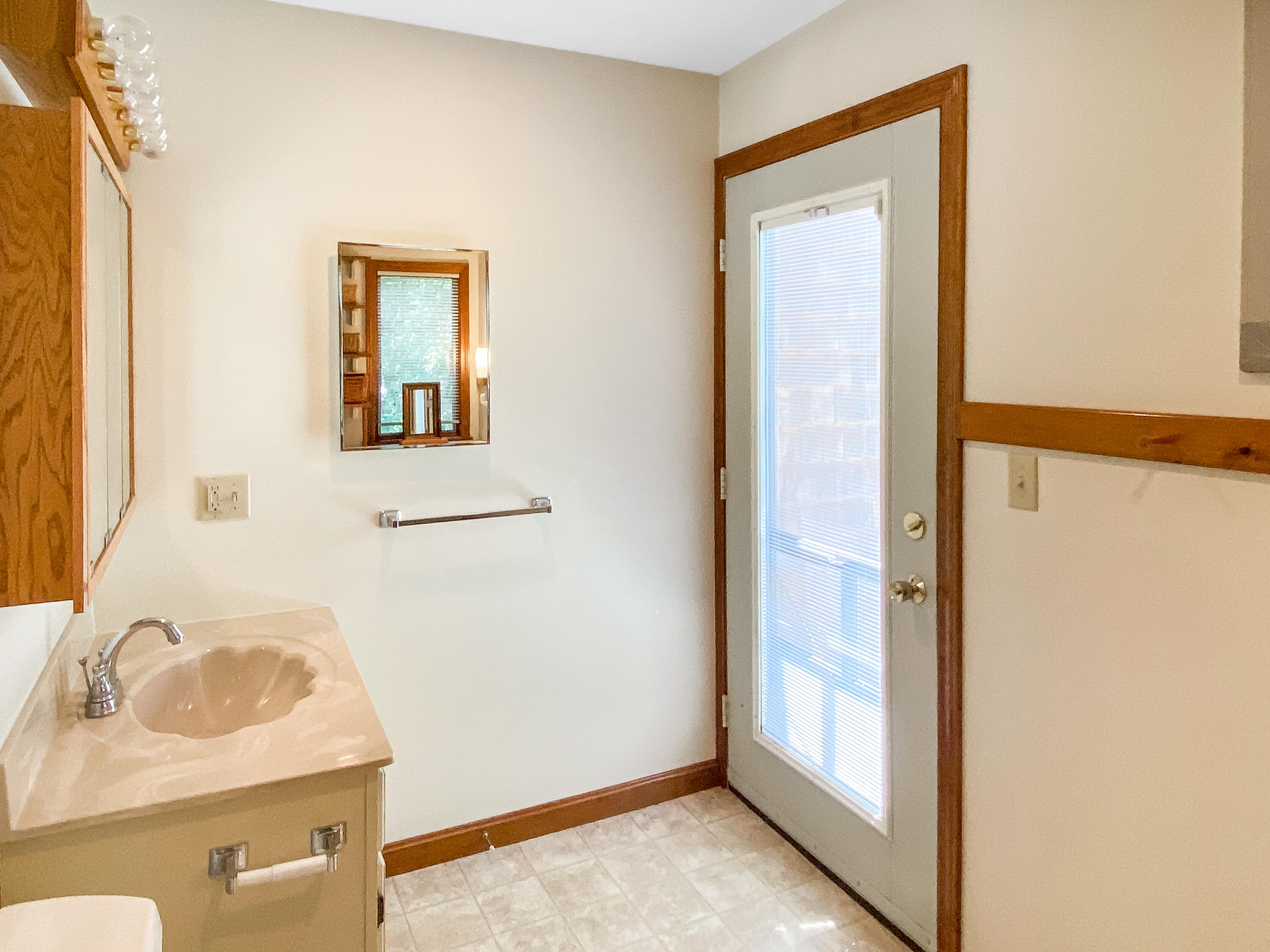54 Marthas Road Edgartown, MA 02539 - Photo 18 of 30 a bathroom with a sink a mirror and shower