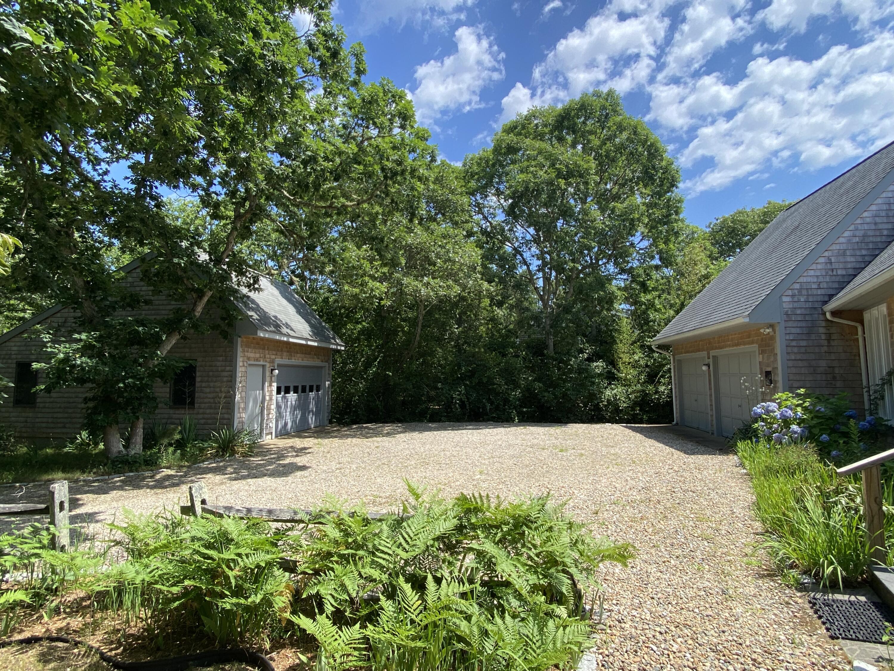 54 Marthas Road Edgartown, MA 02539 - Photo 3 of 30 a swimming pool with outdoor seating and yard