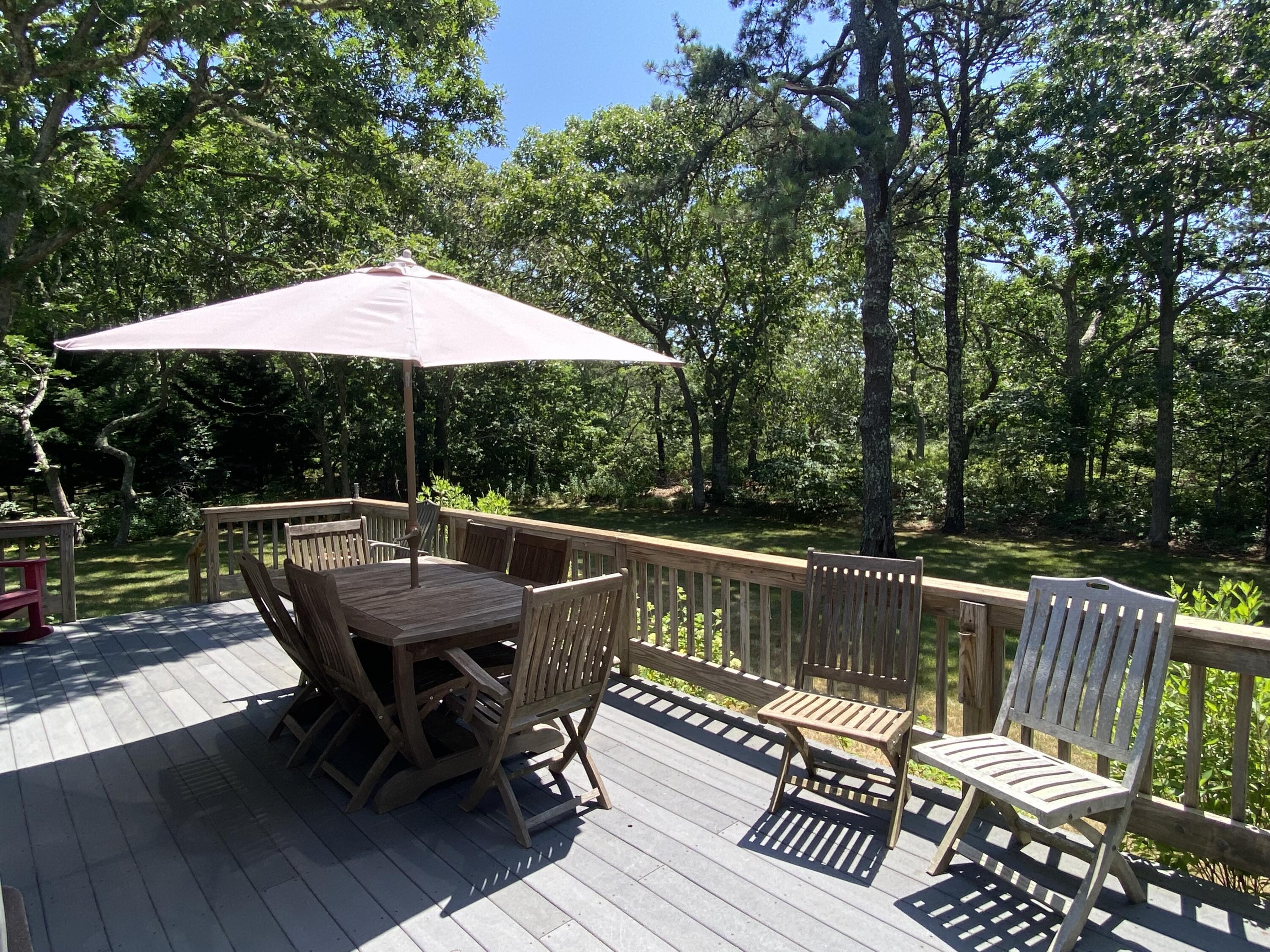 54 Marthas Road Edgartown, MA 02539 - Photo 5 of 30 a view of balcony with wooden floor and outdoor seating