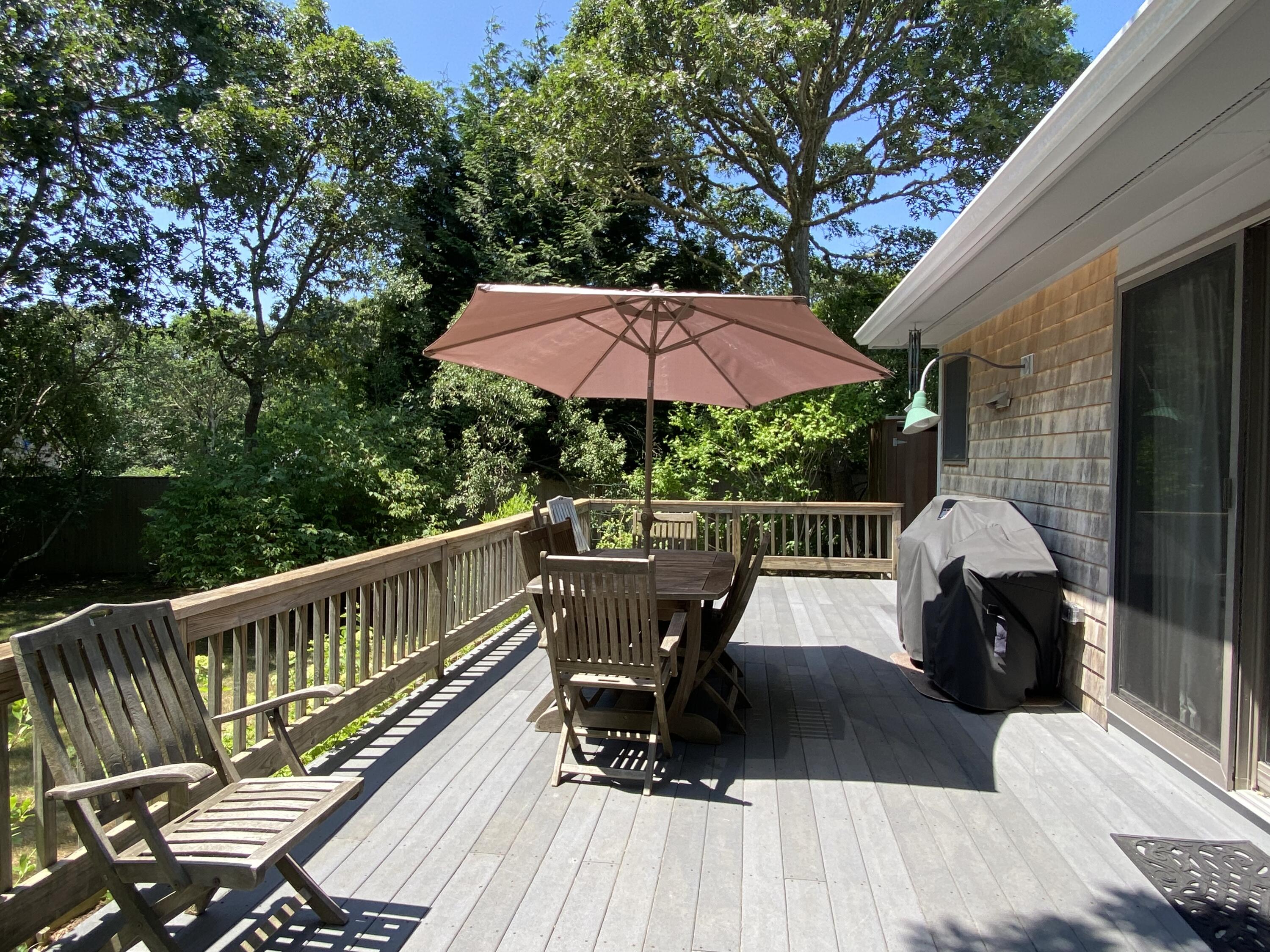 54 Marthas Road Edgartown, MA 02539 - Photo 6 of 30 a view of balcony with wooden floor and outdoor seating