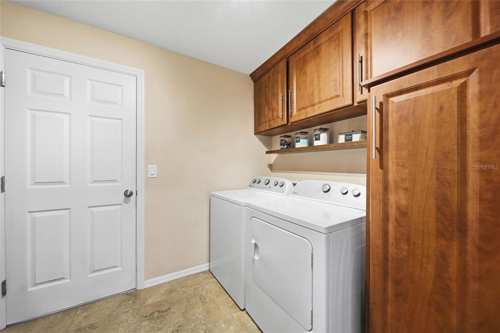 4066 Sundance Pl Loop Mulberry, FL 33860 - Photo 18 of 28 a utility room with dryer and washer