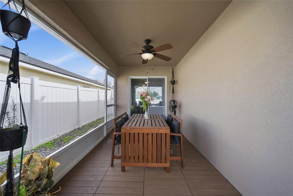 4066 Sundance Pl Loop Mulberry, FL 33860 - Photo 19 of 28 a hallway with a chandelier and wooden floor